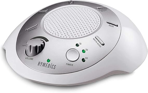 The SoundSleep White Noise Machine in silver is a compact, portable sound therapy device perfect for creating a relaxing environment at home, in the office, or in a nursery. It features six nature sounds and an auto-off timer