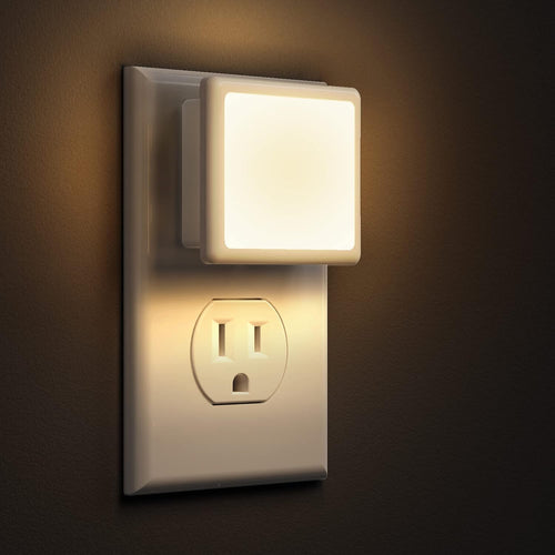 2-Pack LED night lights. Plugs into wall, dusk-to-dawn sensor, soft white (3000K), auto on/off. Ideal for bedrooms, bathrooms, hallways, kitchens.